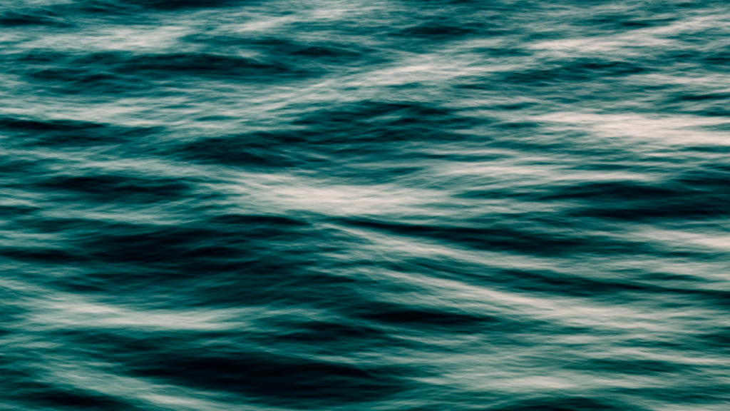 An abstract teal ocean surface with gentle rippling waves, metaphorically illustrating liquidity pools, capital flows, and underlying settlement layers in African stablecoin fintech infrastructure.