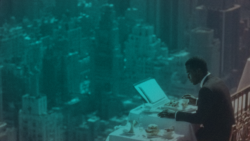 Professional sitting at a high-rise office table overlooking a city skyline, reflecting Zynta's institutional approach to cross-border stablecoin payments and global financial infrastructure