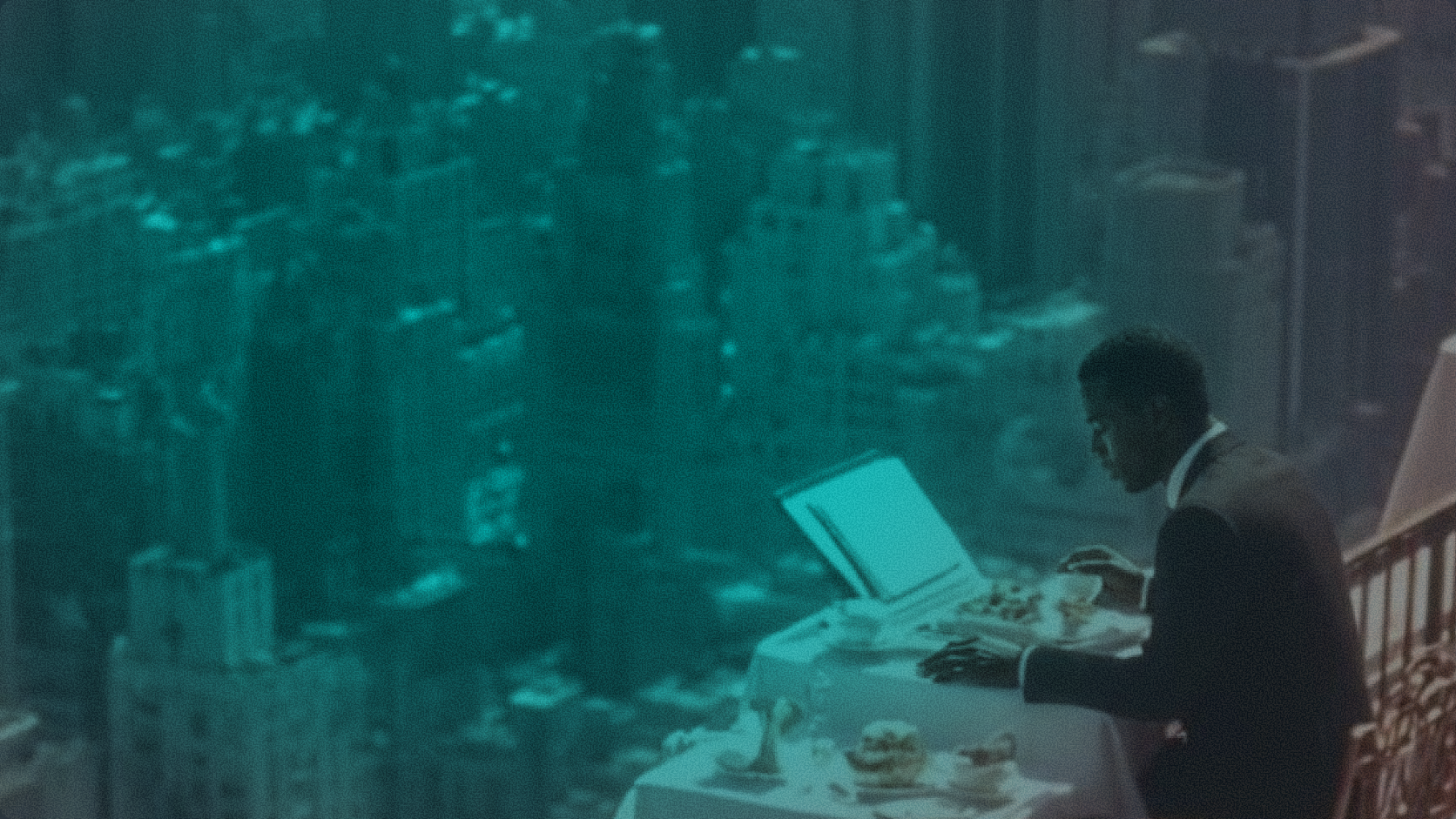 Professional sitting at a high-rise office table overlooking a city skyline, reflecting Zynta's institutional approach to cross-border stablecoin payments and global financial infrastructure