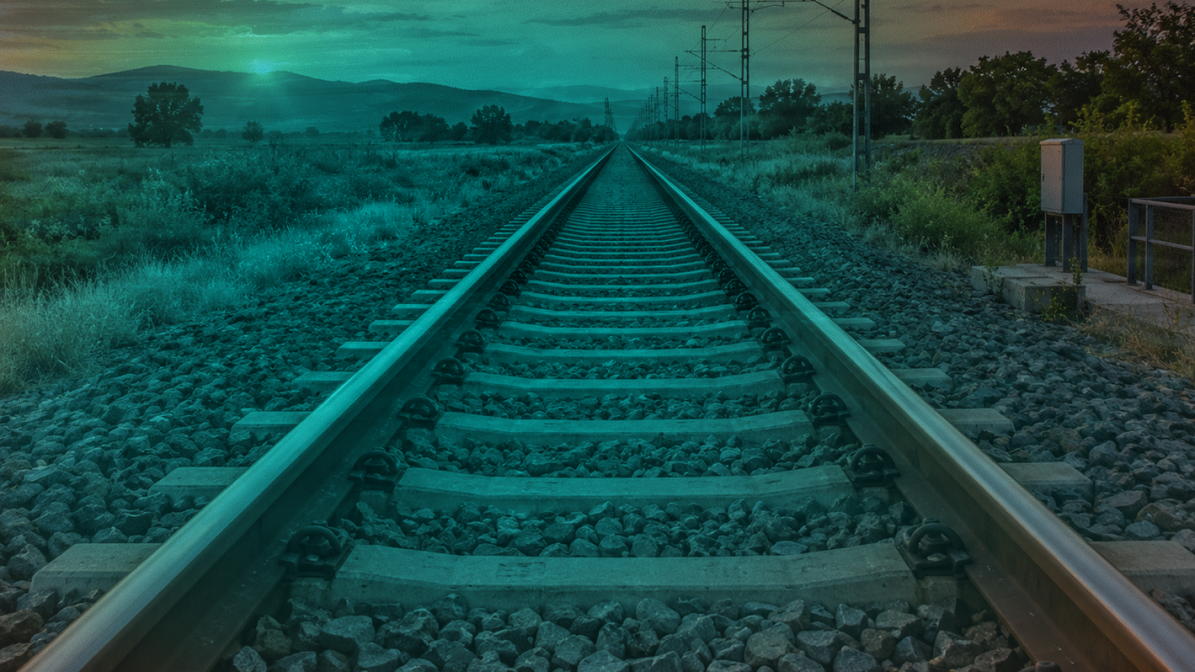 Perspective view of railway tracks stretching into the horizon, symbolizing connected payment rails and cross-border financial infrastructure across West Africa.